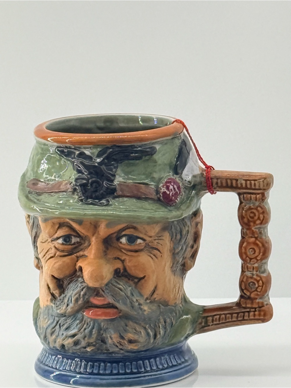 Hand-Painted Ceramic Face Mug in Green and Tan